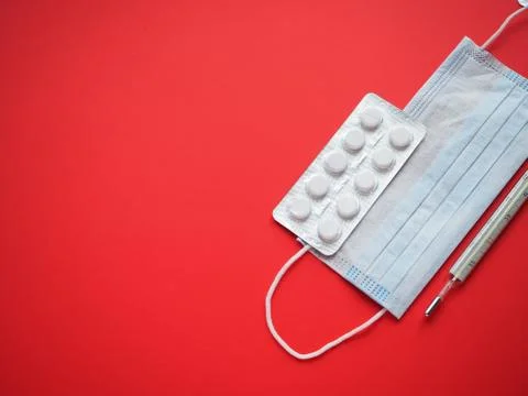 Blister packing tablets with a thermometer Stock Photos