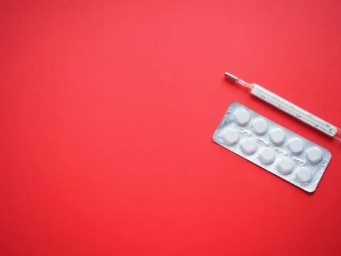 Blister packing tablets with a thermometer Stock Photos