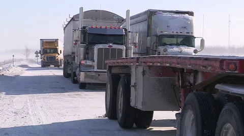 Blizzard and high wind in severe snow storm trucks stranded Stock Footage 44383245