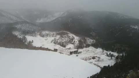 A blizzard blows over a remote Siberian village. Bad weather in the mountains Stock Footage 220052171