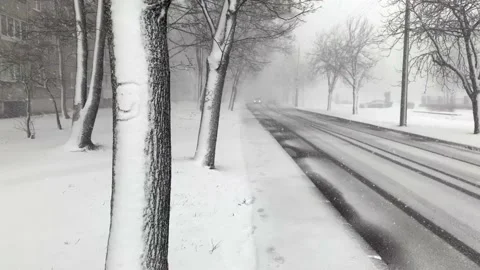Blizzard in the city, heavy snowfall with wind in the city Stock Footage 234978733