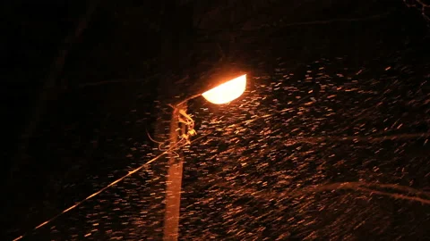 Blizzard in light of lantern lamp Stock Footage 142692299