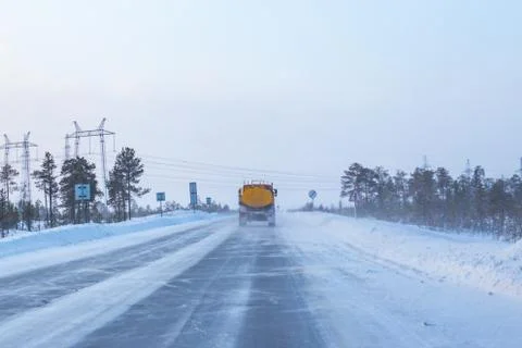 Blizzard on the road in winter Stock Photos