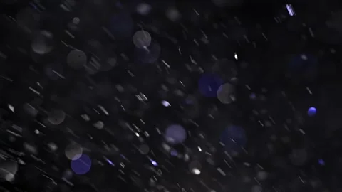 A blizzard of shiny snowflakes. Magic dust. Shimmering particles with bokeh. Vídeo Stock 269707944