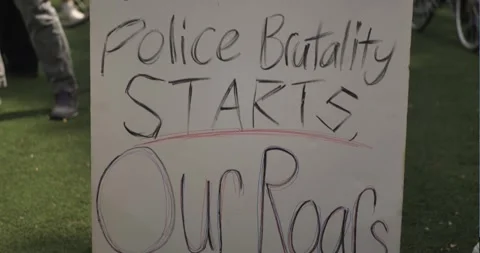 BLM Protester Holds Sign - When Police Brutality Starts Our Roars Start Stock Footage 248941392