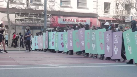 BLM Protesters march holding shields and signs, San Francisco October 2020 Stock Footage 143623543