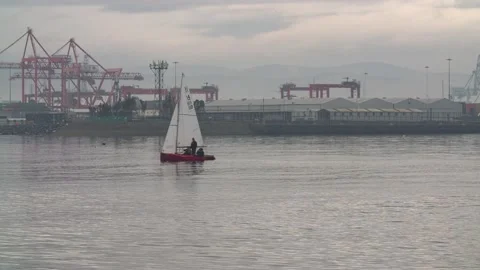 Bloat sailing in front of Poolbeg powerstation Stock Footage 170896215