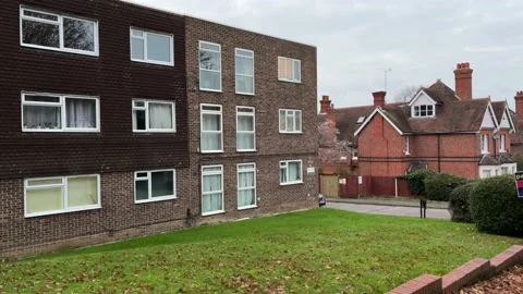 Block of flats next to large Victorian houses in England Stock Footage 223866346