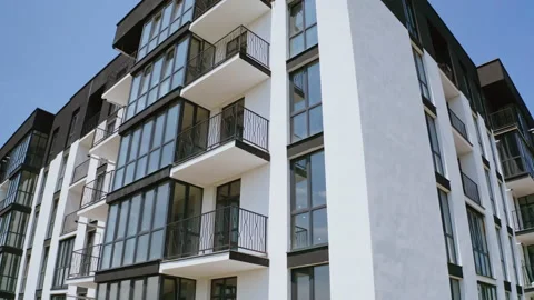 Block of flats on sky background. Modern high-rise apartment building  Video stock 156623351