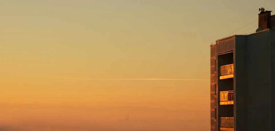 Block of flats in sunset Stock Photos
