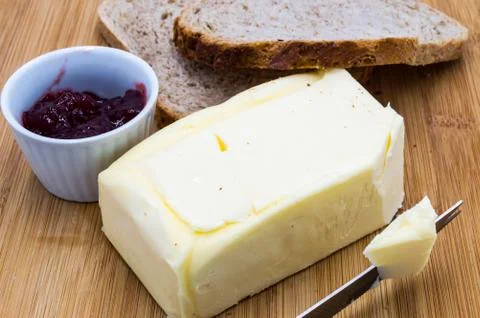 Block of fresh rectangular butter with jam Stock Photos