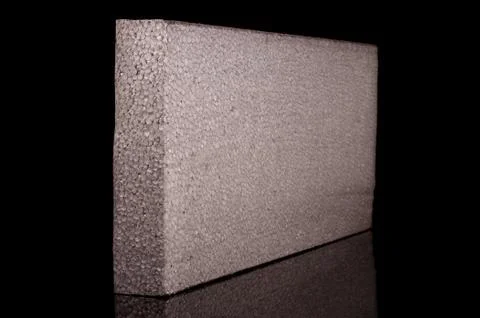 Block of graphite polystyrene isolated on the black background Stock Photos