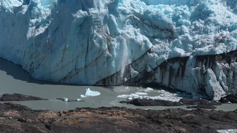 A block of ice carving off of the Perito Moreno glacier Stock Footage 287947050