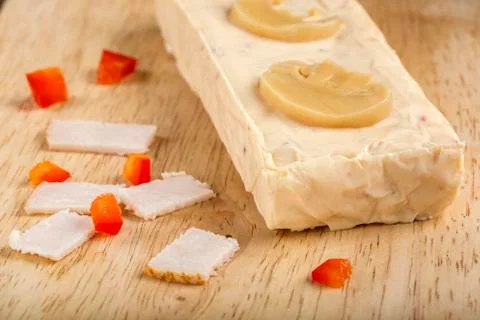 Block of melted cheese with ham, red pepper and mushrooms Foto stock