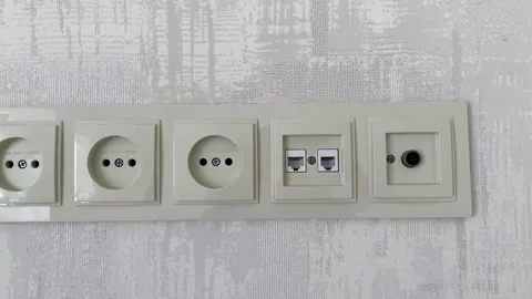A block of new network interfaces on the wall in the apartment. 220v. Vídeos de archivo 249311821
