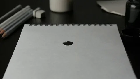 Block Note with Ink Drop Stock Footage 74249642