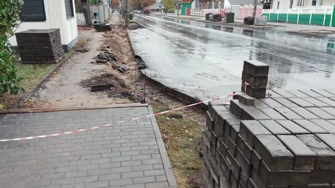 Block of old concrete cobblestones removed from the sidewalk road for further Stock Footage 255635274