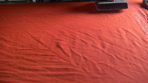 Block Printing - A skilled worker is printing the fabric with blocks Stock Footage 117469072