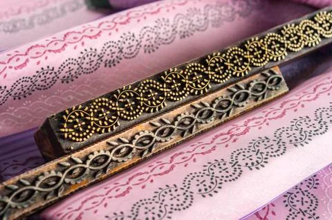 Block printing two woodblocks with patterns and finished printed fabrics Bad Stock Photos