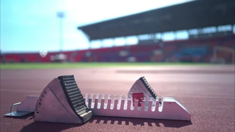 The block start to run on stadium track Stock Footage 257656059