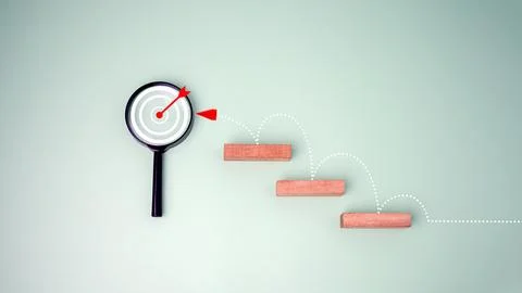 Block step on green background with target board icon on magnifying glasses.. Stock Photos