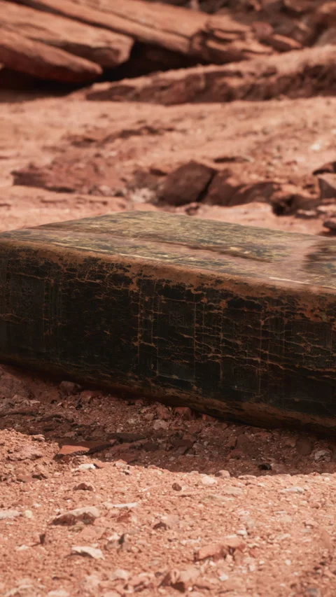 Block of stone on a dry ground in a rocky desert area during daytime Stock Footage 346680332
