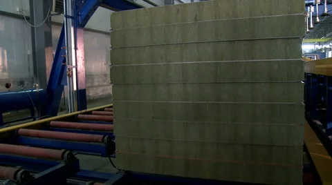 Block of unfinished panel moves along conveyor Stock Footage 58347385