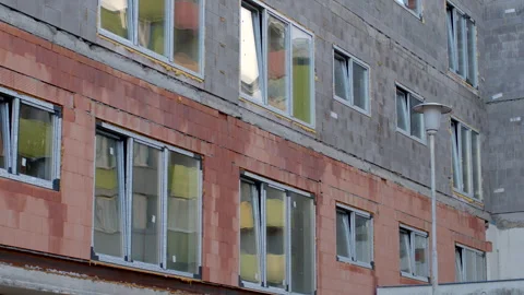 Block wall construction before insulation, windows featuring double-glazed panes Stock Footage 272832615