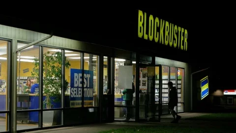 Blockbuster Video In Service Patrons Entering In Silhouette Wide Stock Footage