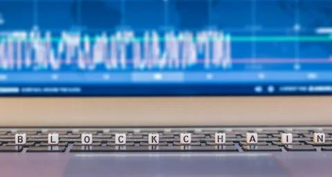 Blockchain dices on laptop Stock Photos