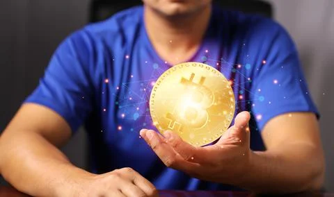 Blockchain technology and network concept. Man holding bitcoin hand with icon Stock-Fotos