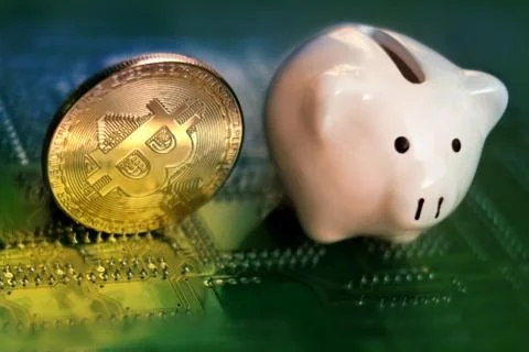 Blockchain technology, bitcoin mining concept. piggy bank waiting for a coin  Stock Photos