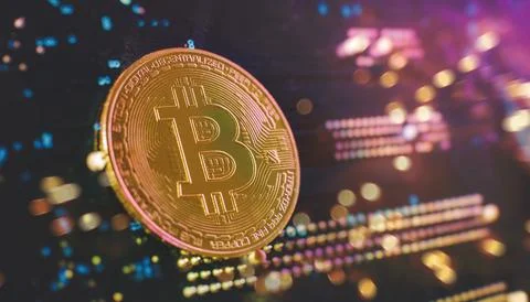 Blockchain technology bitcoin mining concept. Bitcoin golden coin on computer Stock Photos