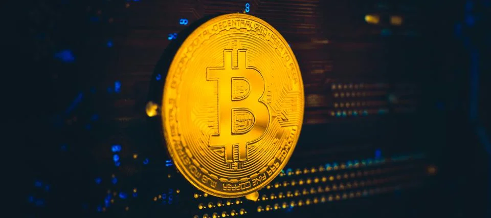 Blockchain technology bitcoin mining concept. Bitcoin golden coin on computer Foto stock