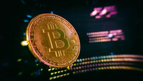 Blockchain technology bitcoin mining concept. Bitcoin golden coin on computer Stock Photos