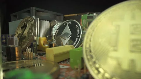 Blockchain technology. Silver coin Etherium is main coin on motherboard Stock Footage 141376741