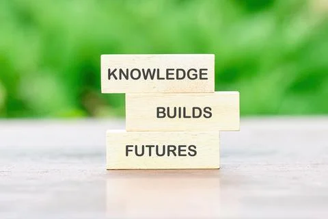 Blocks arranged to convey the message knowledge builds futures represent the  Stock Photos