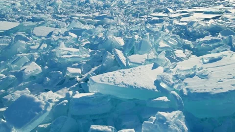Blocks of broken blue ice on winter Baikal lake at sunset. Stock Footage 219956698