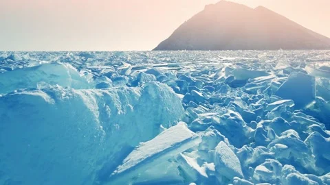 Blocks of broken blue ice on winter Baikal lake at sunset. Video stock 219956728