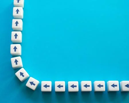 Blocks with chain arrows on a blue background. Moving forward, step by step.  Stock Photos