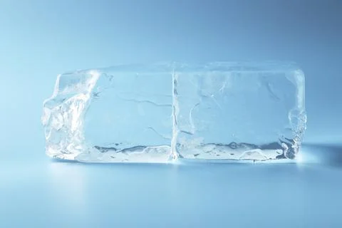 Blocks of clear ice on light blue background Foto stock