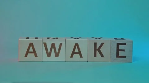Blocks display the word awake in multiple frames, featuring different background Stock Footage 338187736