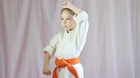 Blocks hands athlete is performing with orange belt Stock Footage 35357773