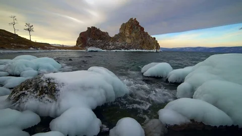 Blocks of ice on the blue waves sunny day Stock Footage 70979402