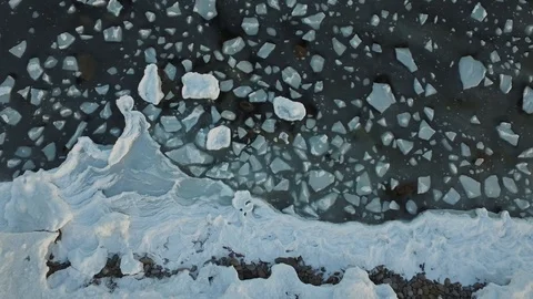 Blocks of ice in winter sea make a beautiful space-like pattern (4k drone video) Stock Footage 89020891