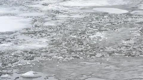 Blocks of melting ice floating on water surface with waves Stock Footage 49689149