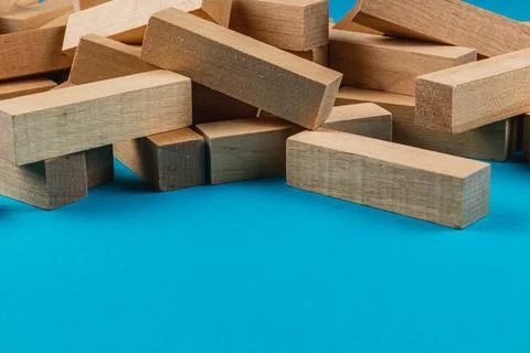 Blocks scattered on a blue surface for creative play Stock Photos
