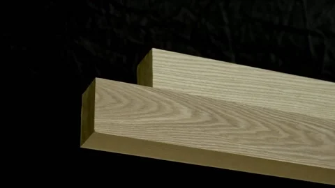 Blocks of wood on a black background rotate slowly Video stock 170019367