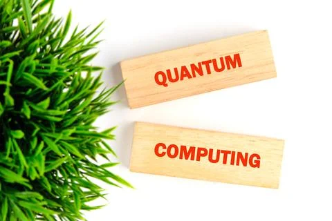 Blocks with the words quantum and computing are placed against a backdrop of  Fotos Stock