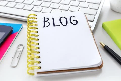 Blog word on notebook on white computer desk with pen Stock Photos